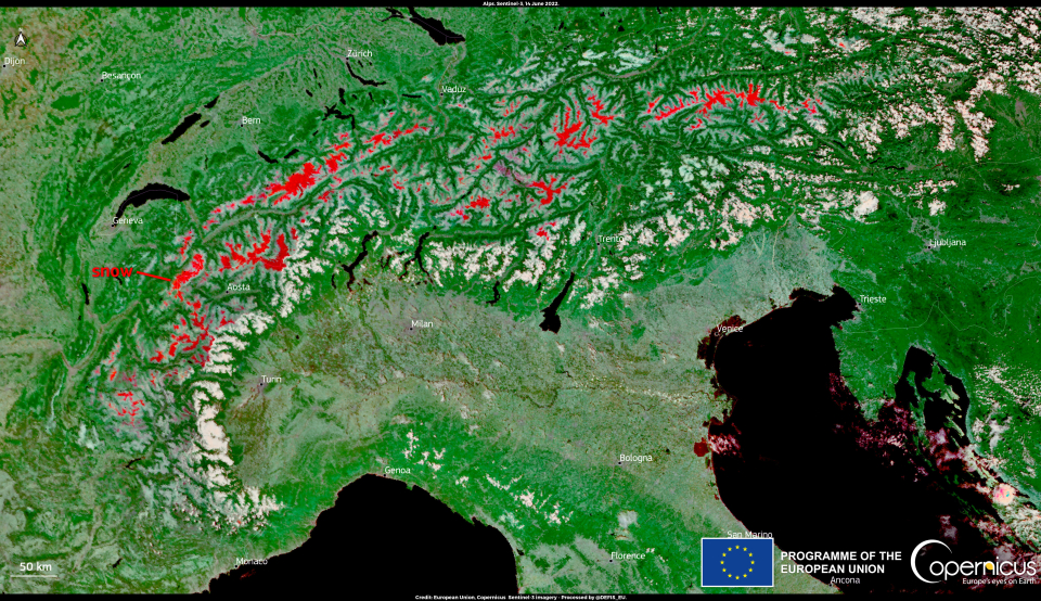 The residual snow cover, shown in red to distinguish it from clouds, is visible in this image, acquired by one of the Copernicus&nbsp;Sentinel-3 satellites on 14 June 2022.Click here to view the image at full resolution.
