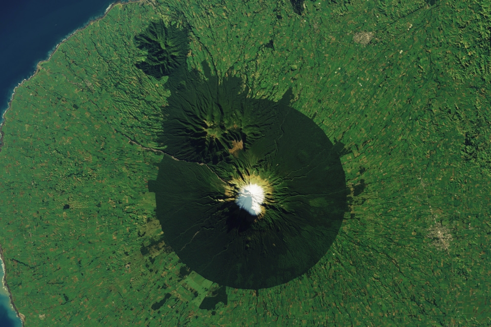 The precise geometry of the protected area encompassing an iconic New Zealand volcano is unmistakable from space.